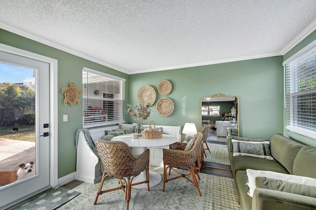 1446 W Perry St, Lantana, FL 33462 - dining space featuring crown molding, a textured ceiling, and wood finished floors