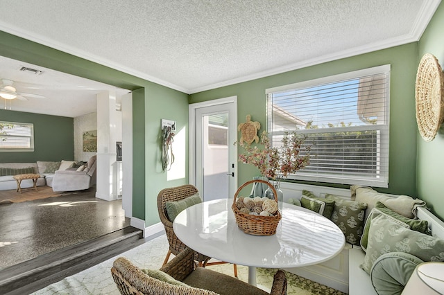 1446 W Perry St, Lantana, FL 33462 - dining area featuring plenty of natural light, wood finished floors, ornamental molding, a textured ceiling, and ceiling fan