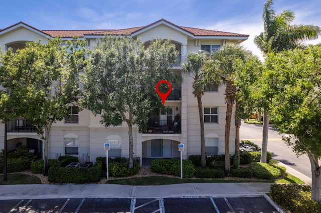 2218 Tuscany Way, Boynton Beach, FL 33435 - view of building exterior with uncovered parking