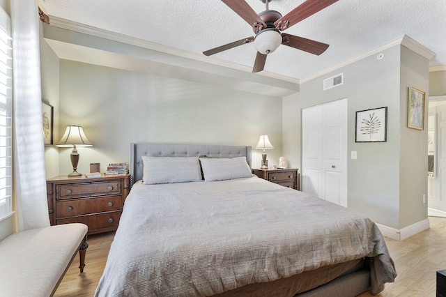 2218 Tuscany Way, Boynton Beach, FL 33435 - bedroom with crown molding, a textured ceiling, light wood-style flooring, and ceiling fan