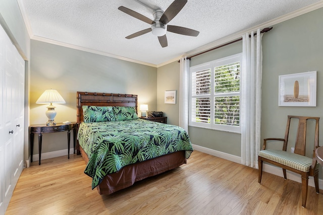 2218 Tuscany Way, Boynton Beach, FL 33435 - bedroom with crown molding, wood finished floors, a textured ceiling, and a ceiling fan
