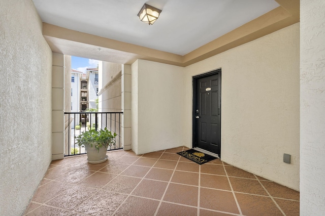 2218 Tuscany Way, Boynton Beach, FL 33435 - property entrance with stucco siding and a balcony