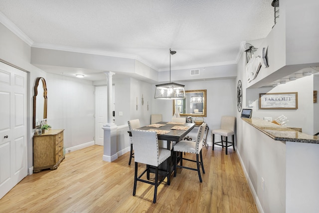 2218 Tuscany Way, Boynton Beach, FL 33435 - dining room with light wood finished floors, ornamental molding, decorative columns, and a textured ceiling
