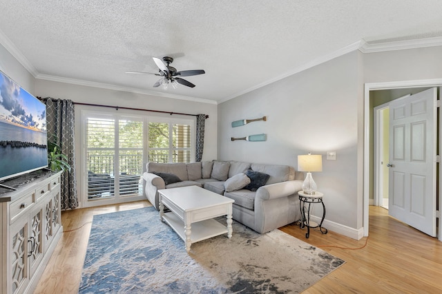 2218 Tuscany Way, Boynton Beach, FL 33435 - living area featuring a ceiling fan, a textured ceiling, light wood-style floors, and ornamental molding