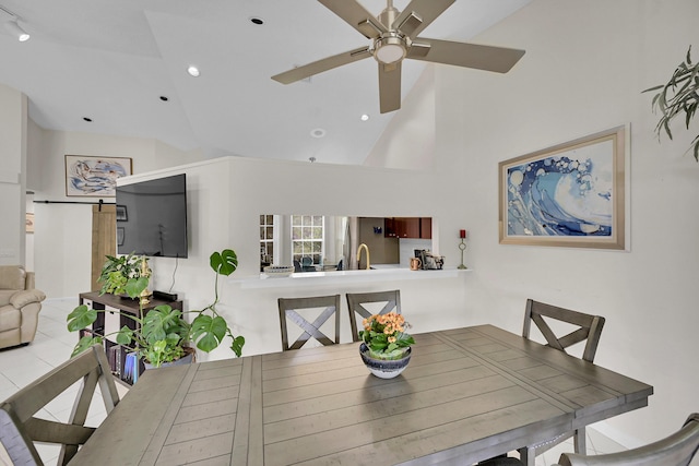 7861 Lexington Club Blvd Unit A, Delray Beach, FL 33446 - dining area featuring a ceiling fan and high vaulted ceiling