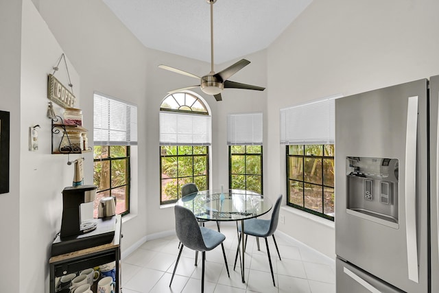 7861 Lexington Club Blvd Unit A, Delray Beach, FL 33446 - dining room featuring healthy amount of natural light, ceiling fan, light tile patterned floors, and high vaulted ceiling