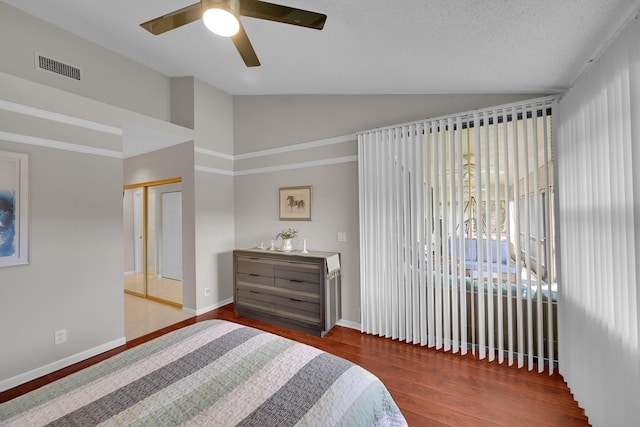 7861 Lexington Club Blvd Unit A, Delray Beach, FL 33446 - bedroom featuring vaulted ceiling, wood finished floors, and ceiling fan