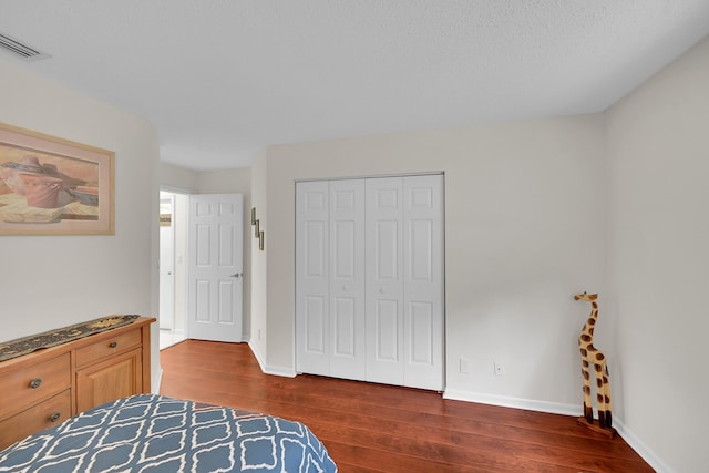 7861 Lexington Club Blvd Unit A, Delray Beach, FL 33446 - bedroom with hardwood / wood-style floors and a closet