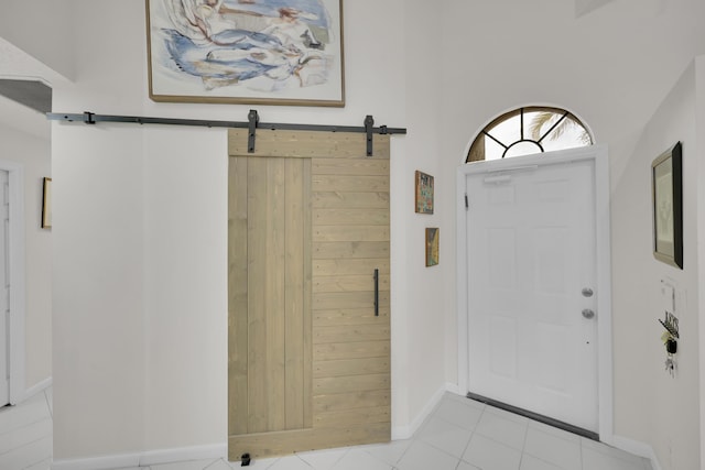7861 Lexington Club Blvd Unit A, Delray Beach, FL 33446 - entryway with a barn door and light tile patterned floors