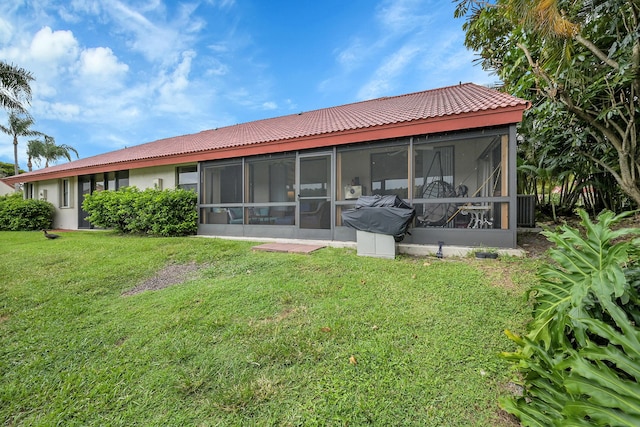 7861 Lexington Club Blvd Unit A, Delray Beach, FL 33446 - back of property with a sunroom, a lawn, and stucco siding
