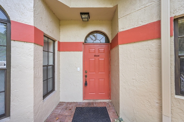 7861 Lexington Club Blvd Unit A, Delray Beach, FL 33446 - doorway to property featuring stucco siding