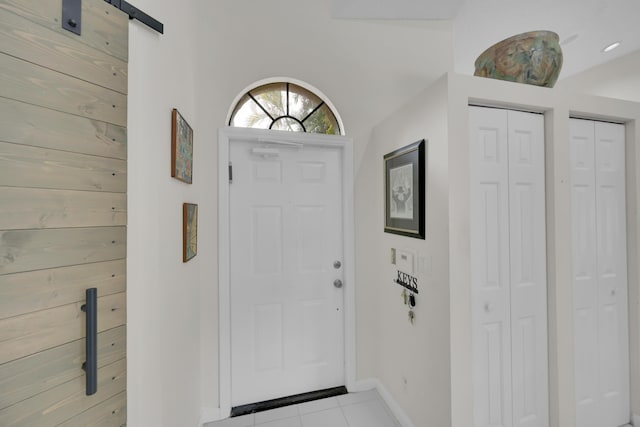 7861 Lexington Club Blvd Unit A, Delray Beach, FL 33446 - foyer with tile patterned floors and a barn door