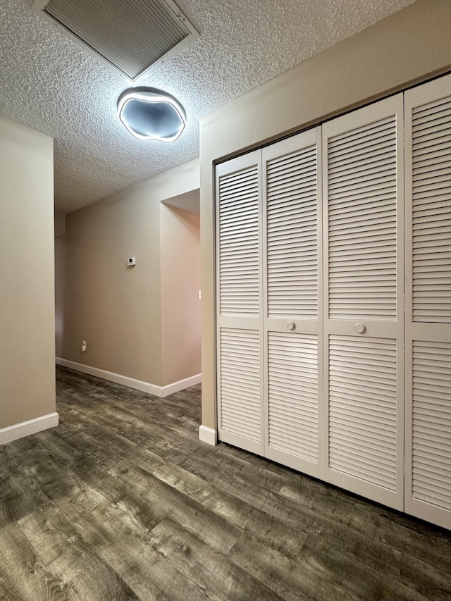 610 SE Forgal St, Port Saint Lucie, FL 34983 - interior space featuring a textured ceiling and dark wood finished floors