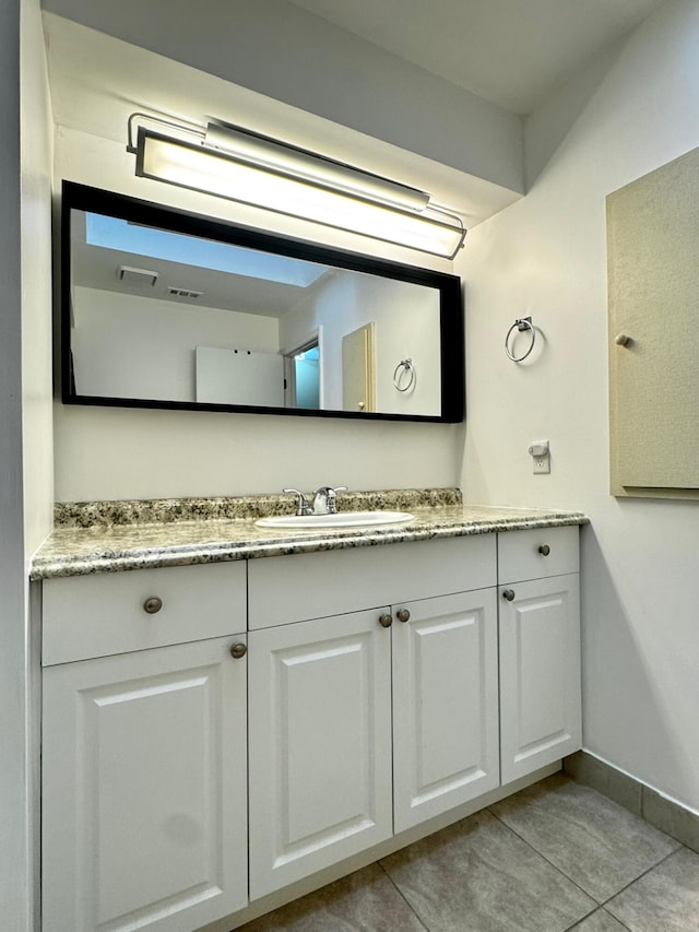 610 SE Forgal St, Port Saint Lucie, FL 34983 - bathroom with vanity and tile patterned flooring