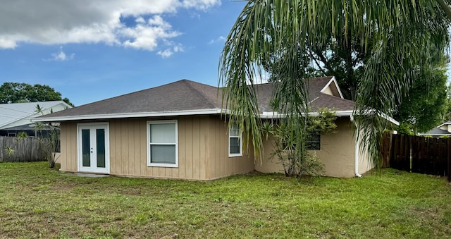 610 SE Forgal St, Port Saint Lucie, FL 34983 - back of property with french doors and roof with shingles