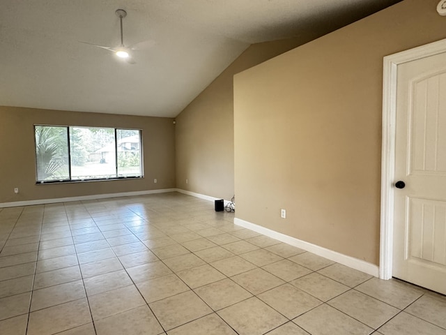 610 SE Forgal St, Port Saint Lucie, FL 34983 - empty room featuring a ceiling fan, light tile patterned flooring, and vaulted ceiling