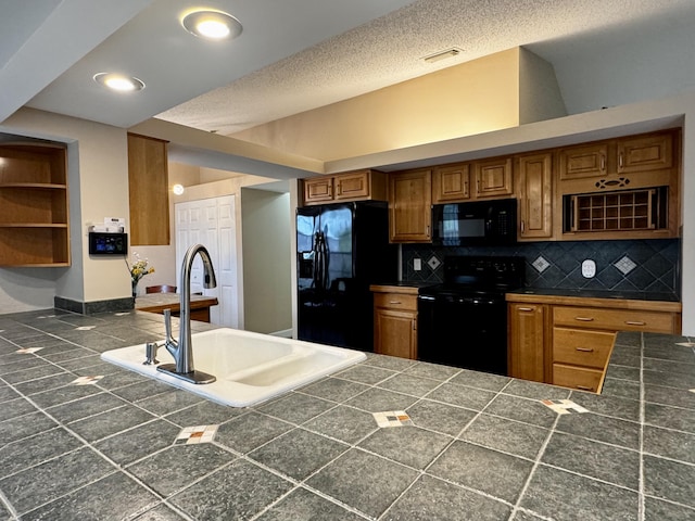 610 SE Forgal St, Port Saint Lucie, FL 34983 - kitchen with black appliances, brown cabinets, backsplash, tile countertops, and recessed lighting
