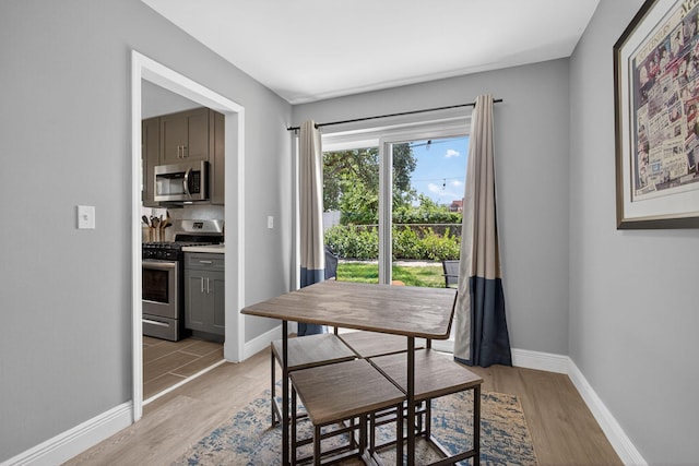 306 N A St, Lake Worth Beach, FL 33460 - dining room featuring light wood-style floors