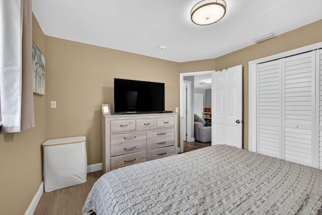306 N A St, Lake Worth Beach, FL 33460 - bedroom featuring wood finished floors and a closet