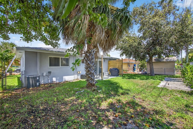 306 N A St, Lake Worth Beach, FL 33460 - back of house featuring stucco siding, a patio area, and a gate
