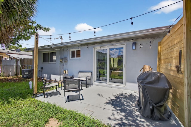 306 N A St, Lake Worth Beach, FL 33460 - back of property with stucco siding and a patio