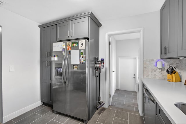 306 N A St, Lake Worth Beach, FL 33460 - kitchen featuring stainless steel appliances, gray cabinets, and light countertops