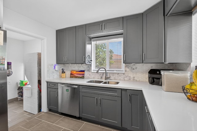 306 N A St, Lake Worth Beach, FL 33460 - kitchen with dishwasher, tasteful backsplash, gray cabinets, light countertops, and light tile patterned floors