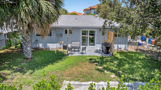 306 N A St, Lake Worth Beach, FL 33460 - back of house with a patio area and a shingled roof