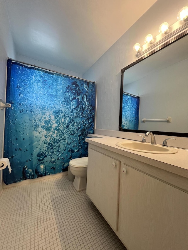 2112 NE 1st Way Unit 206, Boynton Beach, FL 33435 - bathroom featuring vanity, tile patterned flooring, and curtained shower