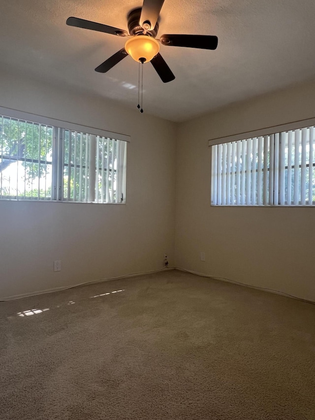 2112 NE 1st Way Unit 206, Boynton Beach, FL 33435 - carpeted spare room with healthy amount of natural light and a ceiling fan