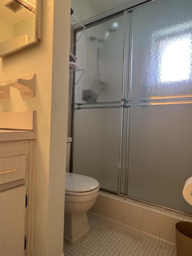 2112 NE 1st Way Unit 206, Boynton Beach, FL 33435 - full bath featuring a shower with shower door, vanity, and tile patterned floors