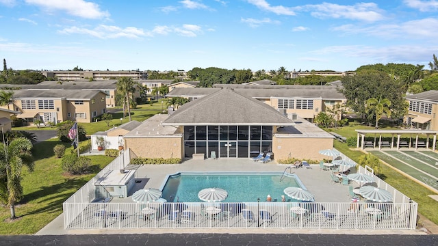 2112 NE 1st Way Unit 206, Boynton Beach, FL 33435 - view of pool with a fenced backyard, a residential view, a patio area, and a sunroom