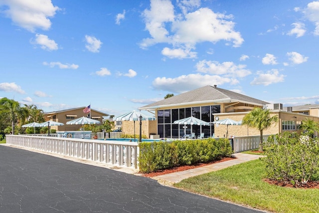 2112 NE 1st Way Unit 206, Boynton Beach, FL 33435 - view of pool with a swimming pool and a sunroom