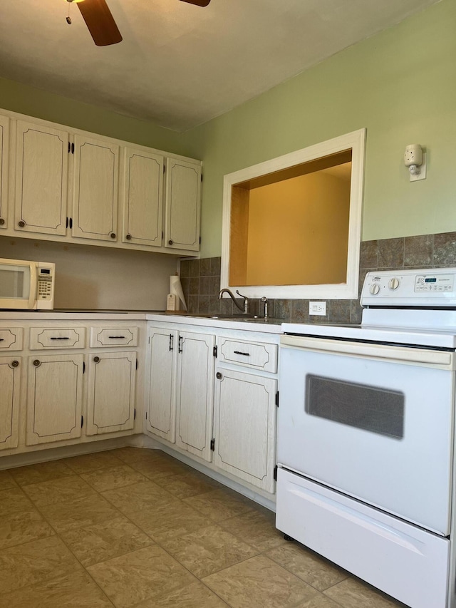 2112 NE 1st Way Unit 206, Boynton Beach, FL 33435 - kitchen featuring white appliances, a ceiling fan, and tasteful backsplash
