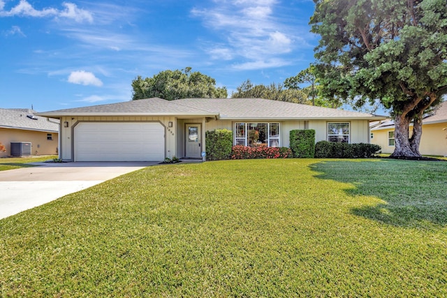 1434 SE Kirke Ln, Port Saint Lucie, FL 34983 - single story home featuring a garage, concrete driveway, and a front lawn