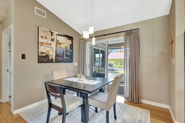 1434 SE Kirke Ln, Port Saint Lucie, FL 34983 - dining space featuring light wood-style flooring and lofted ceiling