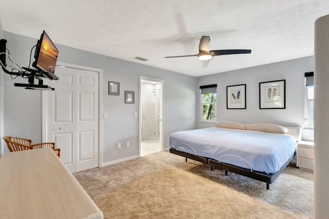 1434 SE Kirke Ln, Port Saint Lucie, FL 34983 - bedroom featuring carpet, ceiling fan, a closet, and ensuite bathroom