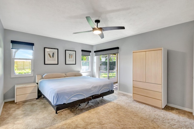 1434 SE Kirke Ln, Port Saint Lucie, FL 34983 - bedroom with light carpet and ceiling fan
