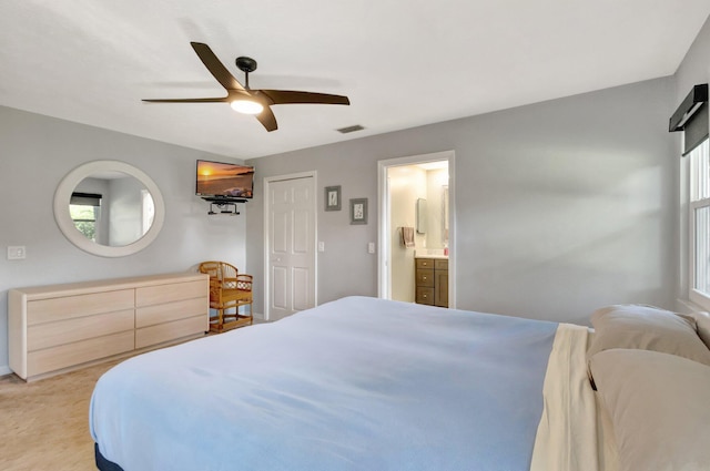 1434 SE Kirke Ln, Port Saint Lucie, FL 34983 - bedroom with a ceiling fan and ensuite bath