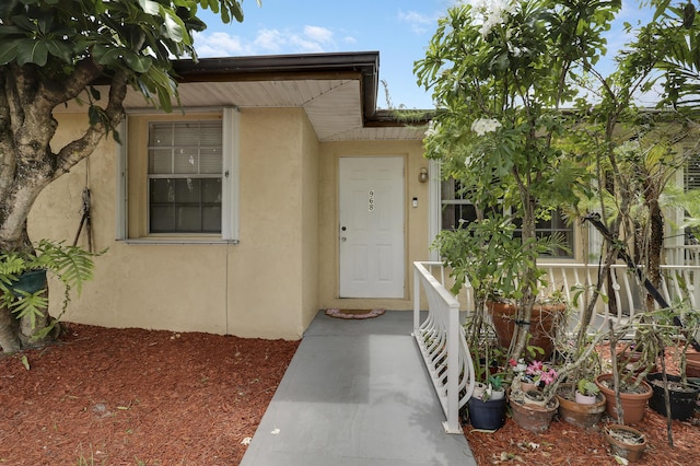 968 Sumter Rd W, West Palm Beach, FL 33415 - doorway to property with stucco siding