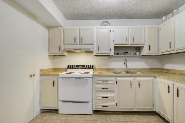968 Sumter Rd W, West Palm Beach, FL 33415 - kitchen featuring white electric range, under cabinet range hood, light tile patterned floors, light countertops, and a textured ceiling