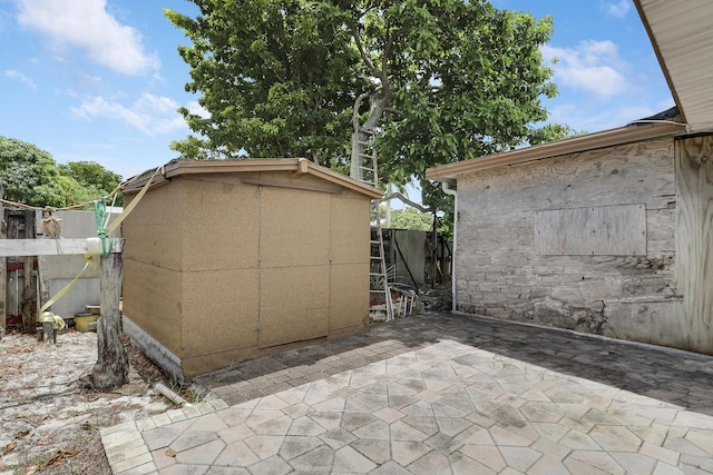 968 Sumter Rd W, West Palm Beach, FL 33415 - view of patio featuring a shed