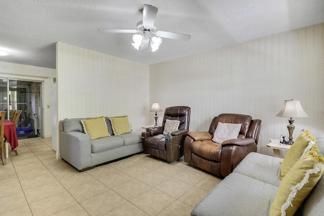 968 Sumter Rd W, West Palm Beach, FL 33415 - living area with light tile patterned flooring, wallpapered walls, a ceiling fan, and a textured ceiling