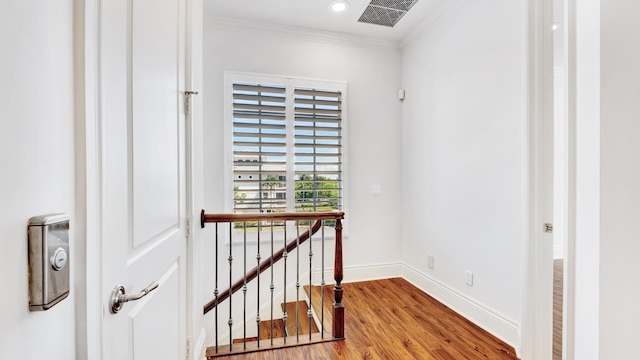 4917 Watersong Way, Fort Pierce, FL 34949 - corridor with ornamental molding, wood finished floors, recessed lighting, and an upstairs landing