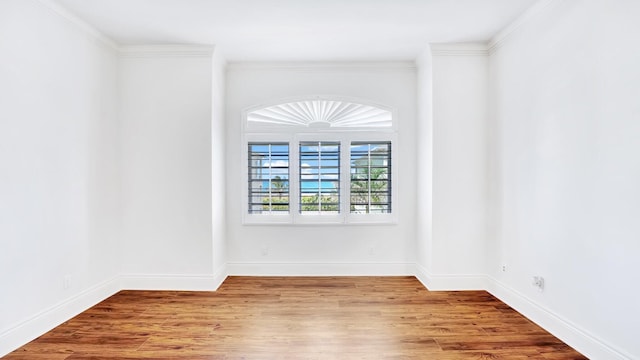 4917 Watersong Way, Fort Pierce, FL 34949 - empty room featuring wood finished floors and crown molding
