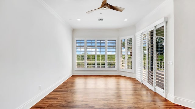 4917 Watersong Way, Fort Pierce, FL 34949 - empty room with crown molding, wood finished floors, ceiling fan, and recessed lighting