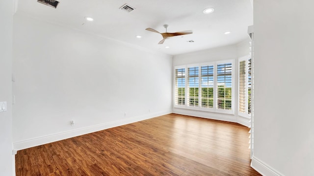 4917 Watersong Way, Fort Pierce, FL 34949 - unfurnished room with a ceiling fan, wood finished floors, crown molding, and recessed lighting