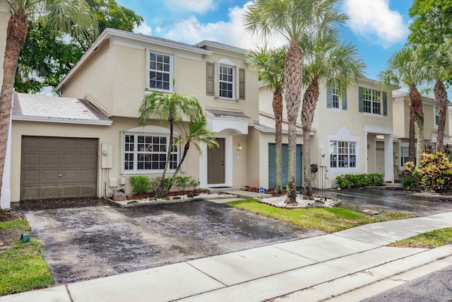 5900 S Golden Beauty Ln Unit 5900, Tamarac, FL 33321 - view of front facade with stucco siding, driveway, and an attached garage