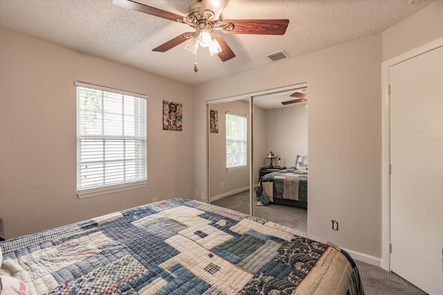 5900 S Golden Beauty Ln Unit 5900, Tamarac, FL 33321 - carpeted bedroom with ceiling fan, a textured ceiling, and a closet