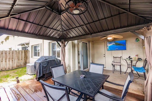 5900 S Golden Beauty Ln Unit 5900, Tamarac, FL 33321 - wooden deck featuring outdoor dining space, a grill, and a ceiling fan